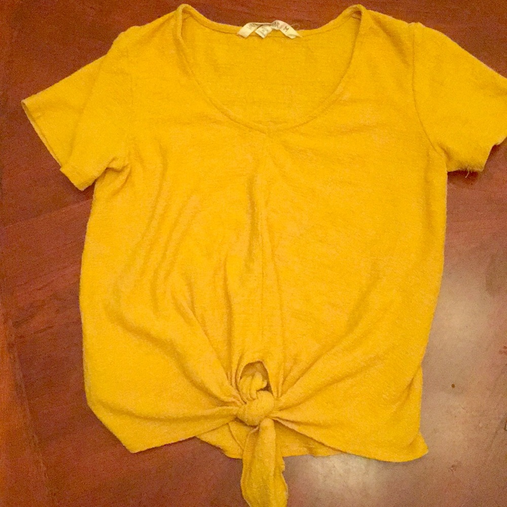 This is a warm mustard yellow shirt